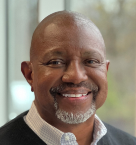 A man smiling at the camera